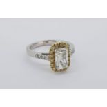 Emerald Cut Diamond Halo Ring, claw set emerald cut diamond approximately 1.14ct, surrounded by a