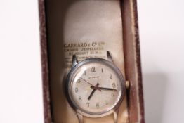 *TO BE SOLD WITHOUT RESERVE*Garrard & Co. watch, stainless steel, in original box, working.