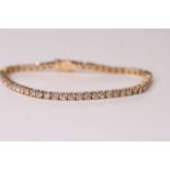 Diamond Tennis Bracelet, set with 60 round brilliant cut diamonds totalling 5.51ct, 14k yellow gold,