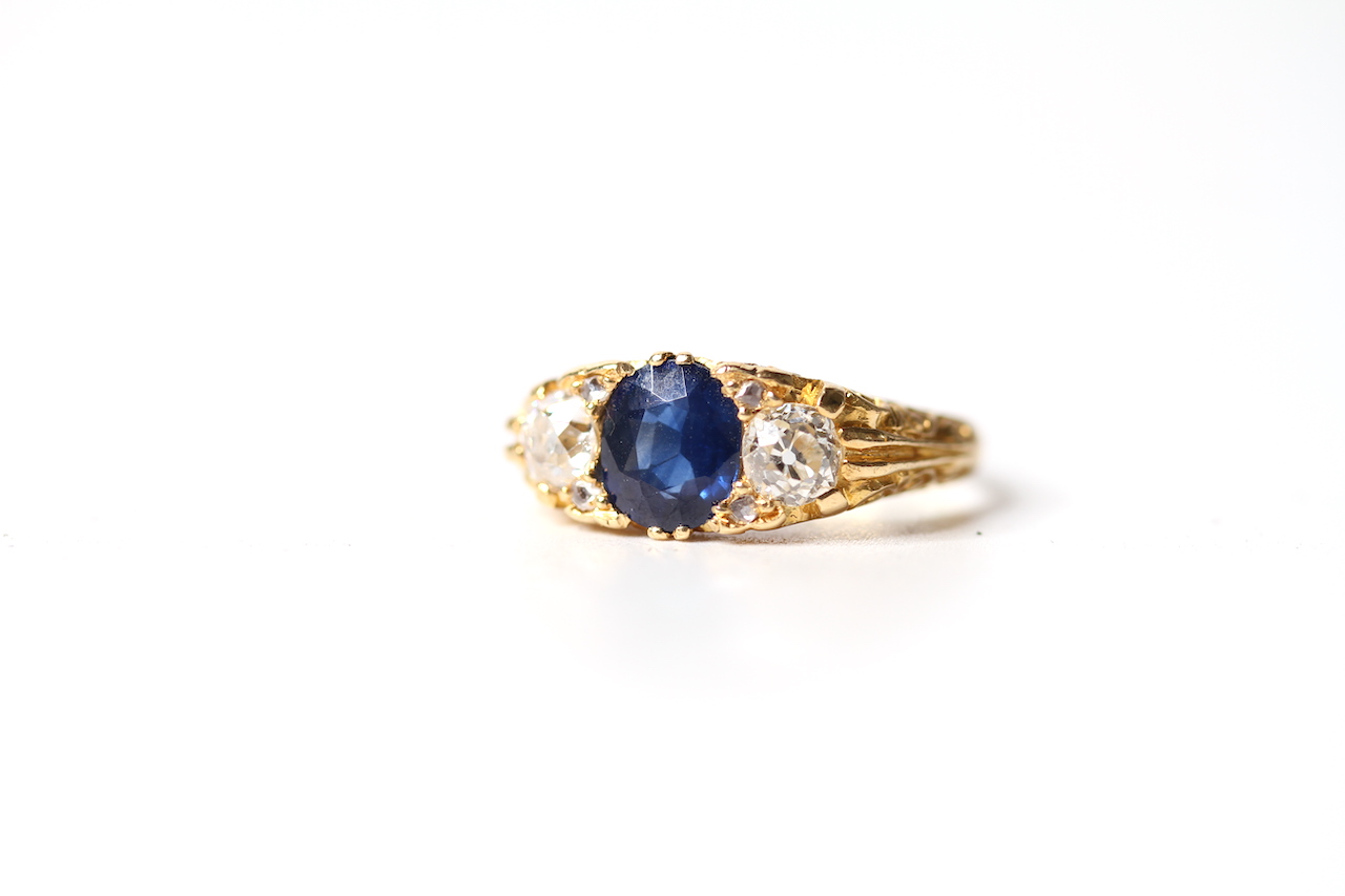 Early 20th Century Sapphire and Old Cut Diamond Three Stone Ring, central sapphire, estimated 1.