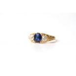 Early 20th Century Sapphire and Old Cut Diamond Three Stone Ring, central sapphire, estimated 1.