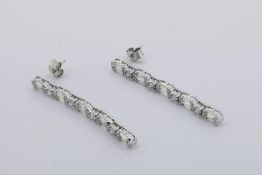 Pair Of Long Diamond Drop Earrings, set with baguette and round brilliant cut diamonds, no weights