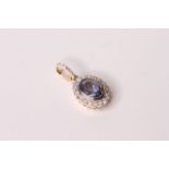Natural Sapphire & Diamond Pendant, set with 1 oval cut sapphire 1.15ct, surrounded by 18 round