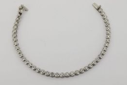 Diamond Tennis Bracelet, bezel set with 44 diamonds, estimated total of 4.00ct, white gold, push