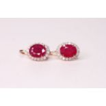 Pair of Natural Ruby & Diamond Earrings, set with 2 oval cut rubies totalling 6.24ct, 36 round