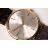 1960S UNIVERSAL GENEVE X TIFFANY & CO 18CT DRESS WATCH, circular off white dial, gold baton hour