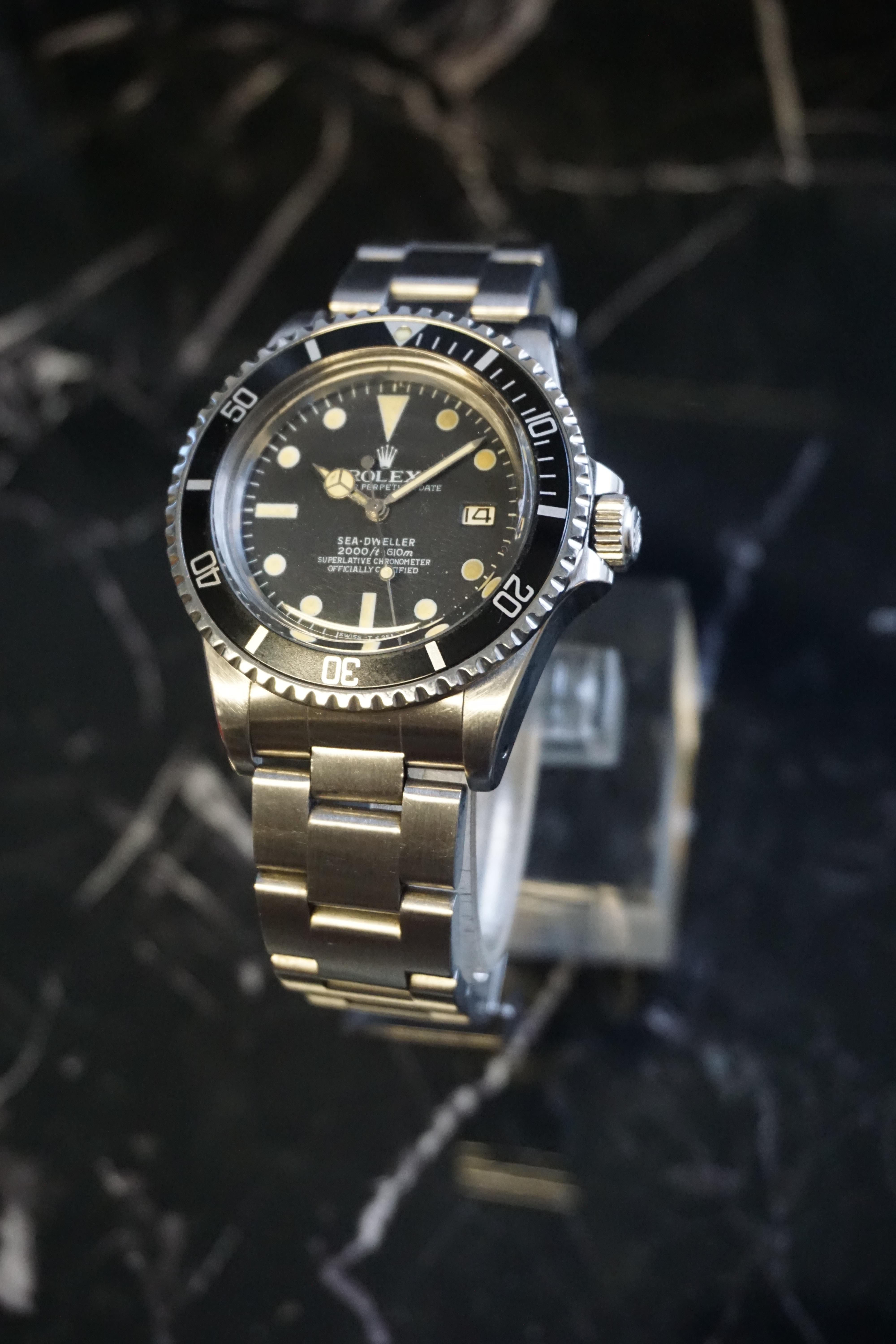 RARE VINTAGE ROLEX OYSTER PERPETUAL DATE SEA -DWELLER REFERENCE 1665 CIRCA 1976, circular black