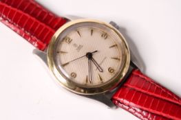 VINTAGE TUDOR OYSTER REFERENCE 7803, circular honey comb dial, dagger and Arabic numerals, gold