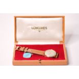 VINTAGE 9CT LONGINES 'EXPLORER' WITH BOX AND TAG CIRCA 1962, circular cream dial, gold baton and