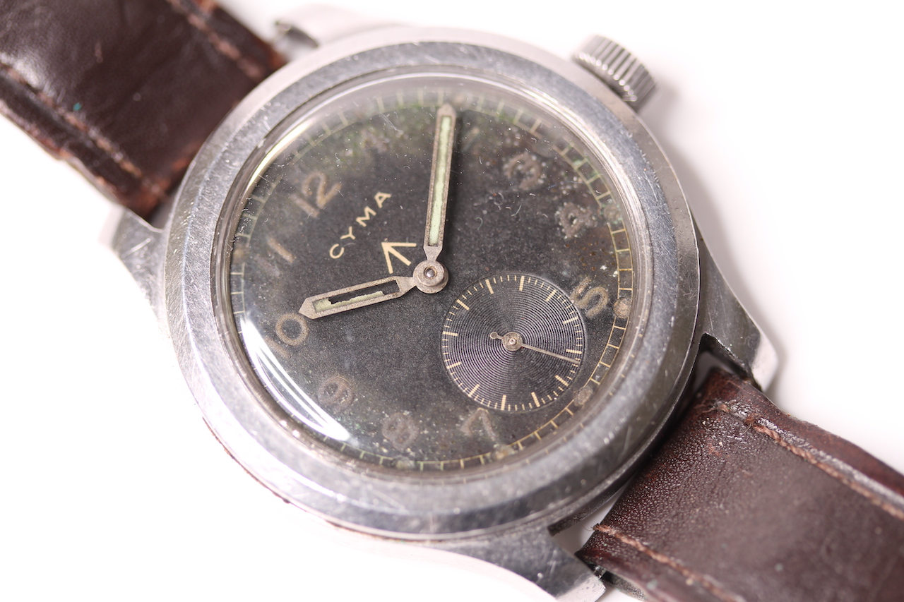 DIRTY DOZEN MILITARY CYMA 1940S WRISTWATCH, circular black dial, untouched, Arabic luminous hour