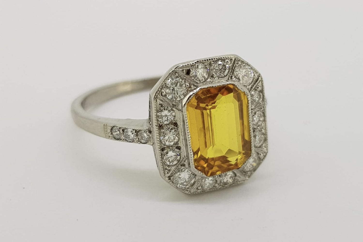 Platinum Octagonal Cut Yellow Sapphire & Diamond Ring, yellow sapphire set in a rub over setting,