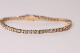 Diamond Tennis Bracelet, set with 60 round brilliant cut diamonds totalling 5.51ct, 14k yellow gold,
