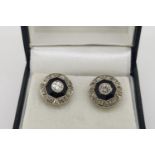 Pair of Art Deco Onyx & Diamond Earrings, with open flower scroll butterfly backs, white gold.