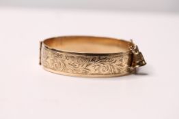 *TO BE SOLD WITHOUT RESERVE*A 9ct yellow gold metal core bangle, L. 6cm approx