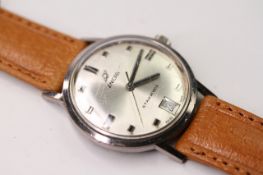 VINTAGE ENICA STARJEWELS WRISTWATCH, circular silver dial with block hour markers, date