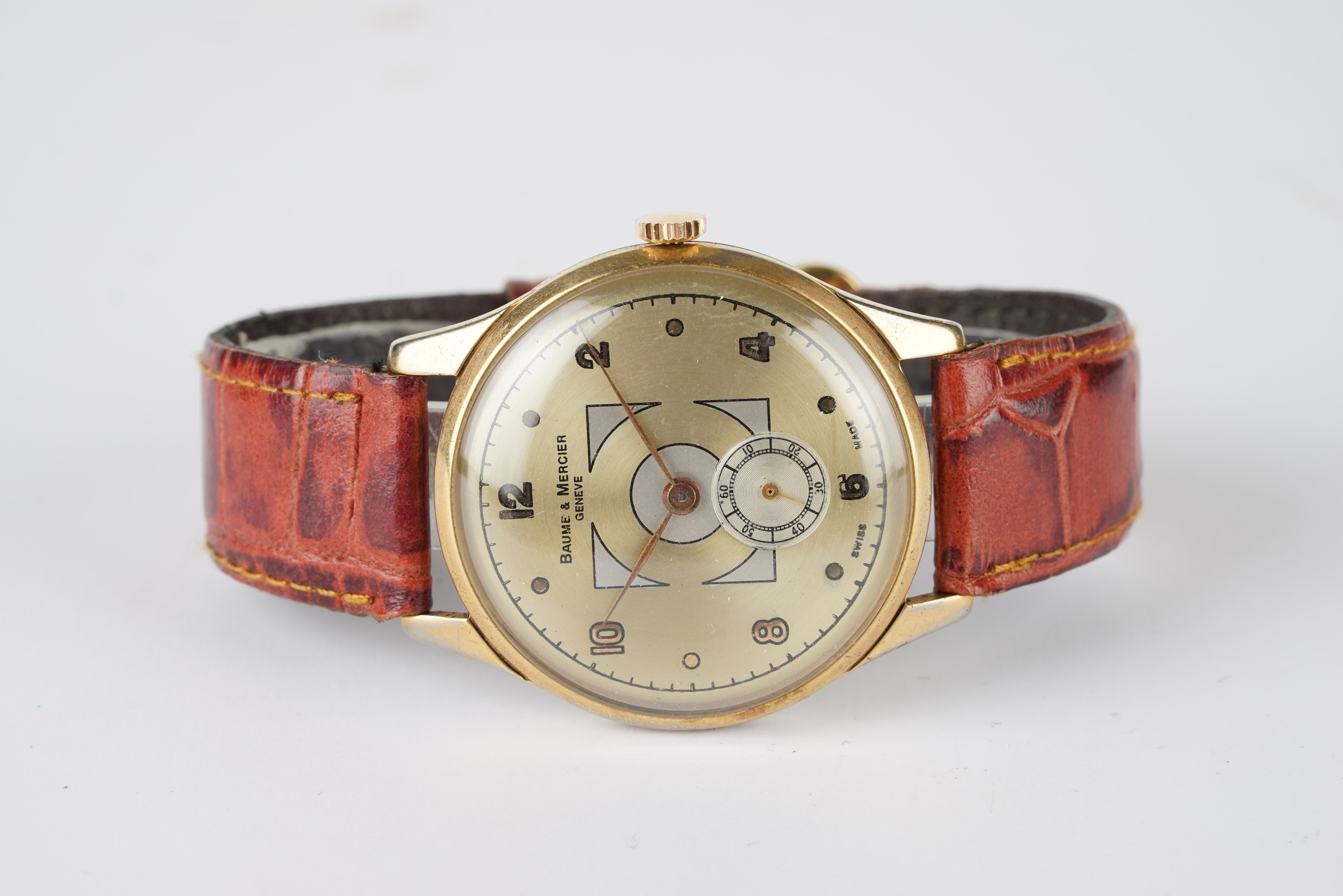 GENTLEMENS BAUME & MERCIER WRISTWATCH, circular gold dial with arabic numeral hour markers and