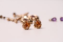 *TO BE SOLD WITHOUT RESERVE*A collection of 3 gem set earrings include a pair of amethyst and