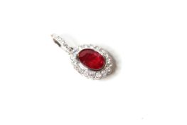 Natural Ruby & Diamond Pendant, set with1 oval cut natural ruby and 24 round brilliant cut diamonds,