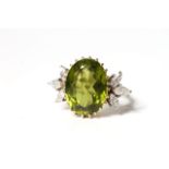 Peridot and Diamond Cocktail Ring, large oval cut peridot, approximately 16x12mm, with a trefoil