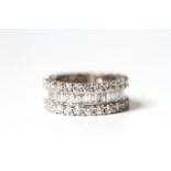 6.16ct Diamond full eternity band, two rows of brilliant cut diamonds, central channel of baguette