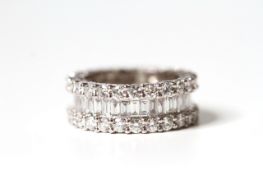 6.16ct Diamond full eternity band, two rows of brilliant cut diamonds, central channel of baguette