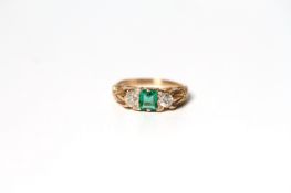 Emerald and Diamond Three Stone Carved Half Hoop Ring, central emerald, a old cut diamond to each