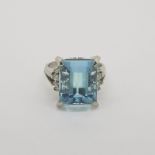Aquamarine & Diamond Ring, claw set aquamarine is set between split shoulders topped with 4 round