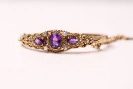 *TO BE SOLD WITHOUT RESERVE*A Victorian style amethyst and split pearl hinged bangle,