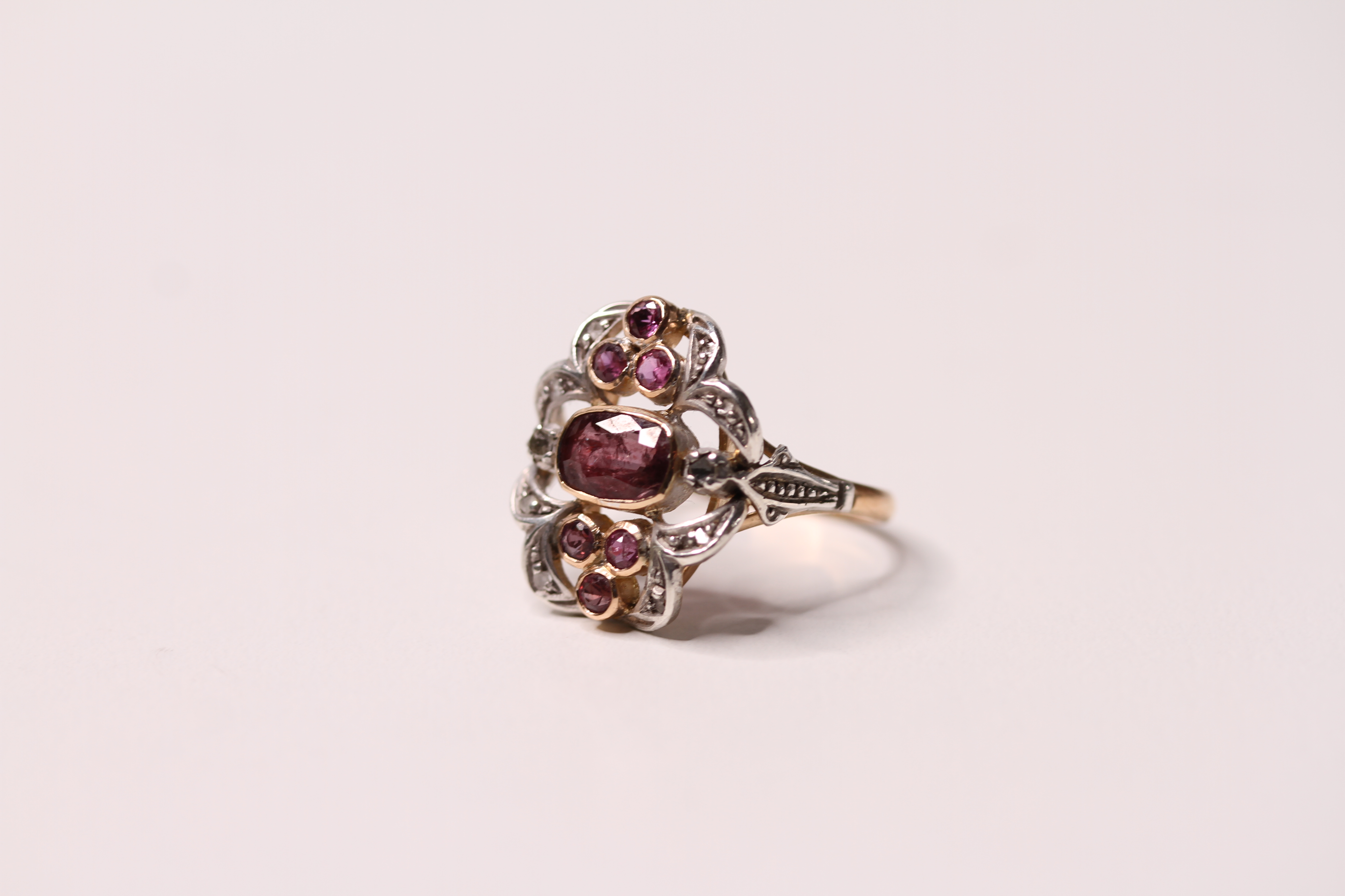 *TO BE SOLD WITHOUT RESERVE*A vintage 14ct gold ruby and diamond cocktail ring of floral form having