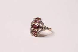 *TO BE SOLD WITHOUT RESERVE*A vintage 14ct gold ruby and diamond cocktail ring of floral form having