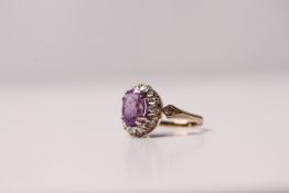 *TO BE SOLD WITHOUT RESERVE*A 9ct gold ring set with amethyst & approximately 0.16ct of diamonds