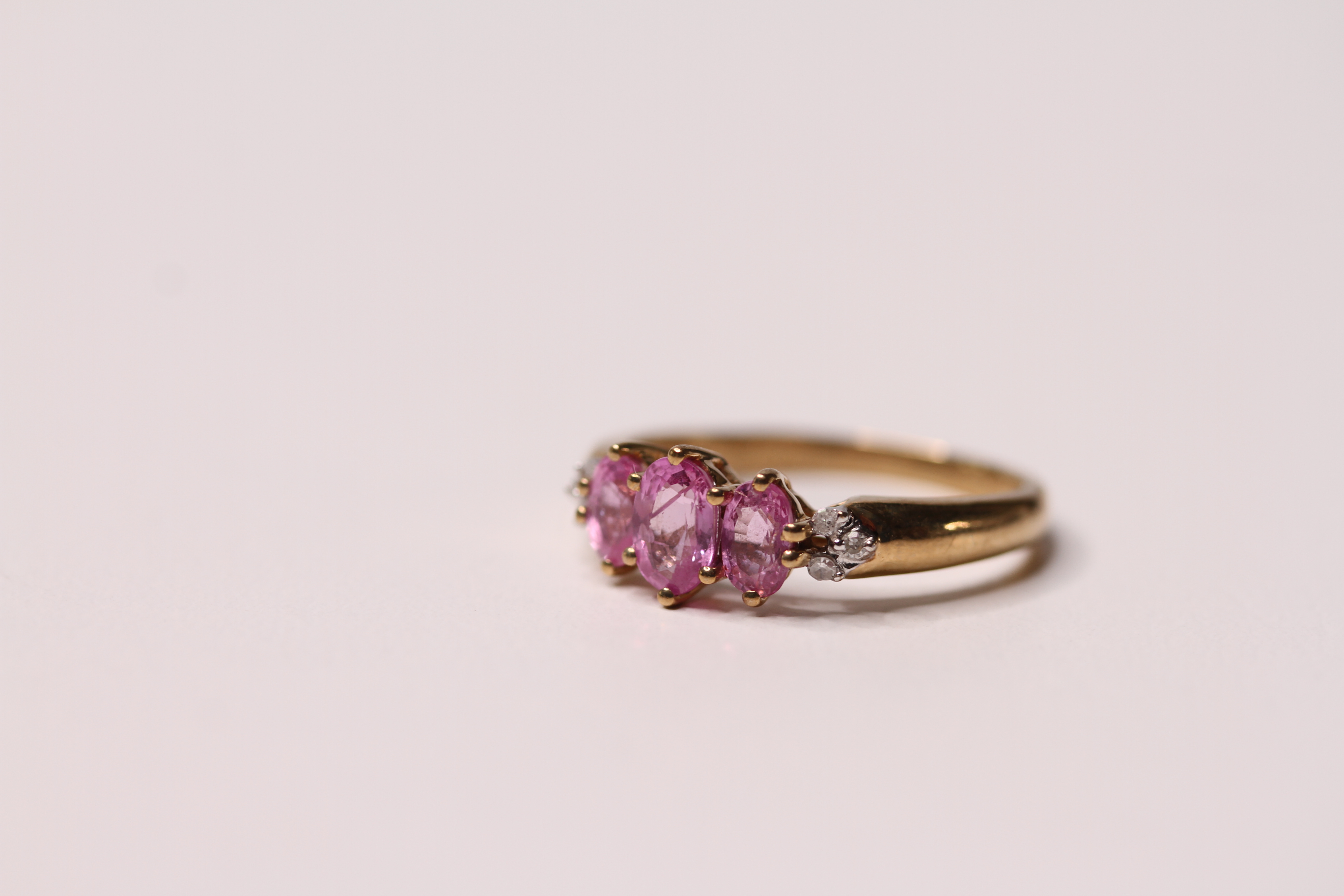 *TO BE SOLD WITHOUT RESERVE*Pink sapphire and diamond ring, three oval cut pink sapphires with three