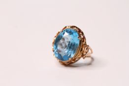 *TO BE SOLD WITHOUT RESERVE*A blue topaz and continental gold ring, oval stone measuring approx 16mm