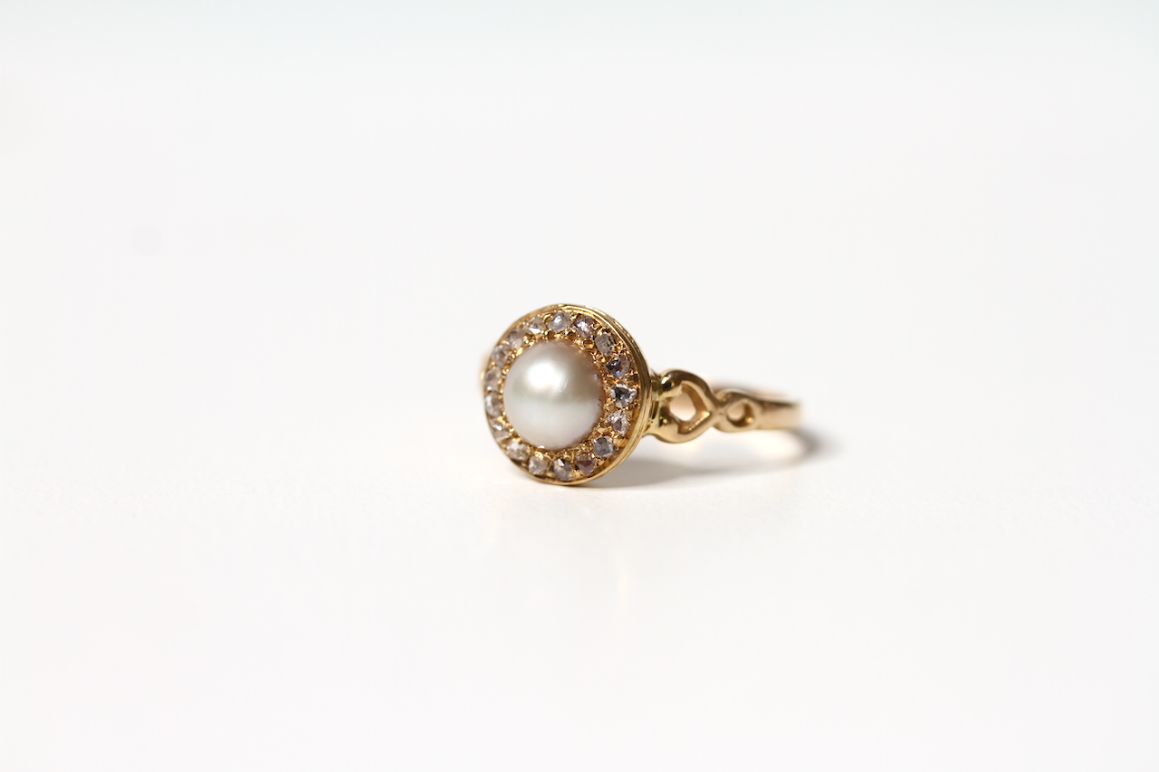 Early 20th Century Pearl and Rose Cut Diamond Ring, central pearl, a border of bright rose cut