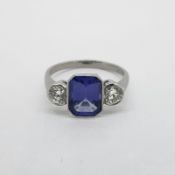 Tanzanite & Diamond 3 Stone Ring, octagonal step cut tanzanite is set between two brilliant cut