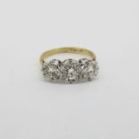 3 Stone Diamond Ring, diamonds are set in white gold on a yellow gold ring mount, total