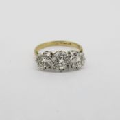 3 Stone Diamond Ring, diamonds are set in white gold on a yellow gold ring mount, total