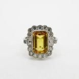 Octagonal Step Cut Yellow Sapphire Ring, yellow sapphire is in a rub over setting with a surround of