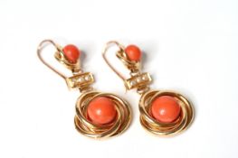 Coral and Pearl Drop Earrings, cabochon cut coral, within a gold twist, suspended from peal and