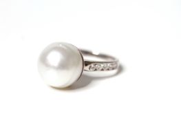 Pearl and Diamond Dress Ring, feature 13.5mm white pearl, diamond set shoulders, in white gold