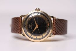 1950s WITTNAUER WRIST WATCH, circular black quartered dial with 10ct yellow gold filled inner bezel,