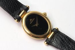 VINTAGE 18CT JAEGER LE COULTRE OVAL WATCH, circular black dial, 22mm yellow gold case, black leather