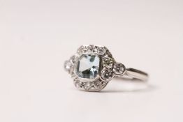 Asscher Cut Aquamarine & Diamond Ring, aquamarine set in a bezel setting inside a surround of 12