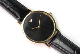 ZENITH SWISS QUARTZ WRIST WATCH, circular black dial with gold circular baton at 12 0'clock, gold