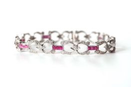 18ct Diamond and Ruby Bracelet, horse shoe Art Deco design, brilliant cut diamonds, 18cm long,