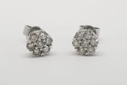 Pair Of Diamond Cluster Stud Earrings, total approximate diamond weight  0.72ct, earrings and