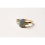 Opal & Diamond Ring, set with 1 cabochon cut natural opal 1.56ct, 2 round brilliant cut diamonds set