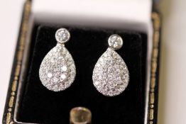 Pair Of Diamond Set Pear Shaped Drop Earrings, on a bezel set diamond stud with post and butterfly