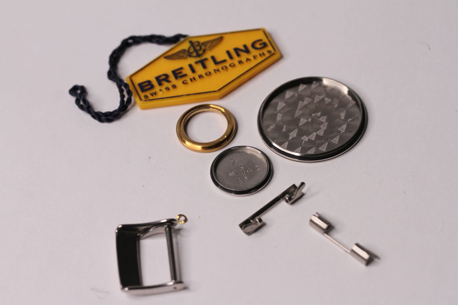 BREITLING PARTS, CASE BACKS, SWING TAG, BUCKLES ETC