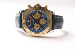 BREITLING CHRONOMAT 44 GMT REFERENCE CB0420 2014 WITH TRAVEL BOX AND PAPERS, circular blue dial,